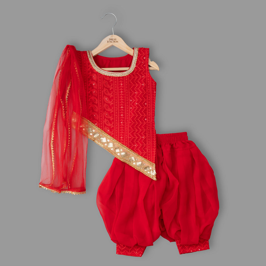 Red traditional outfit with gold details on a gray background