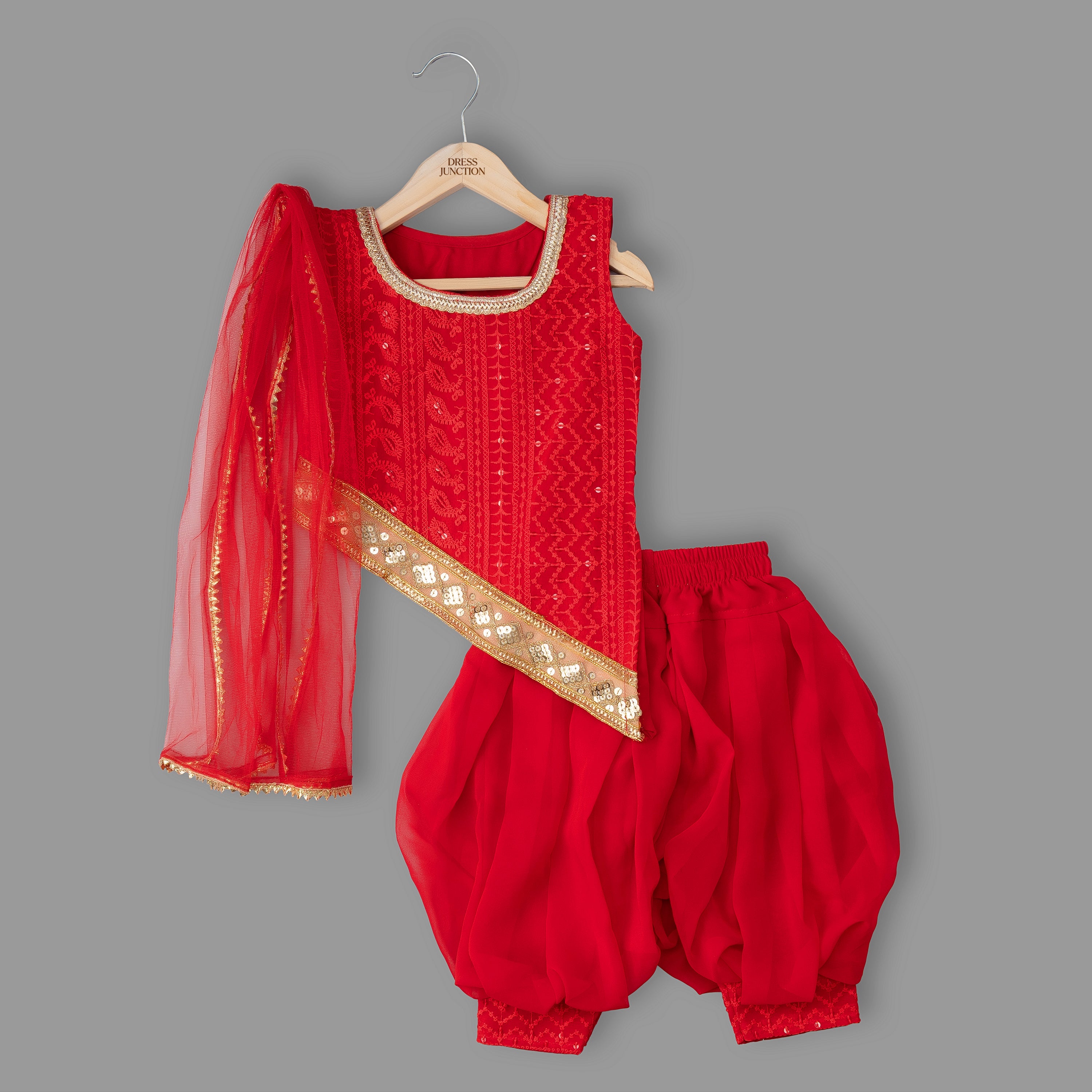 Red traditional outfit with gold details on a gray background
