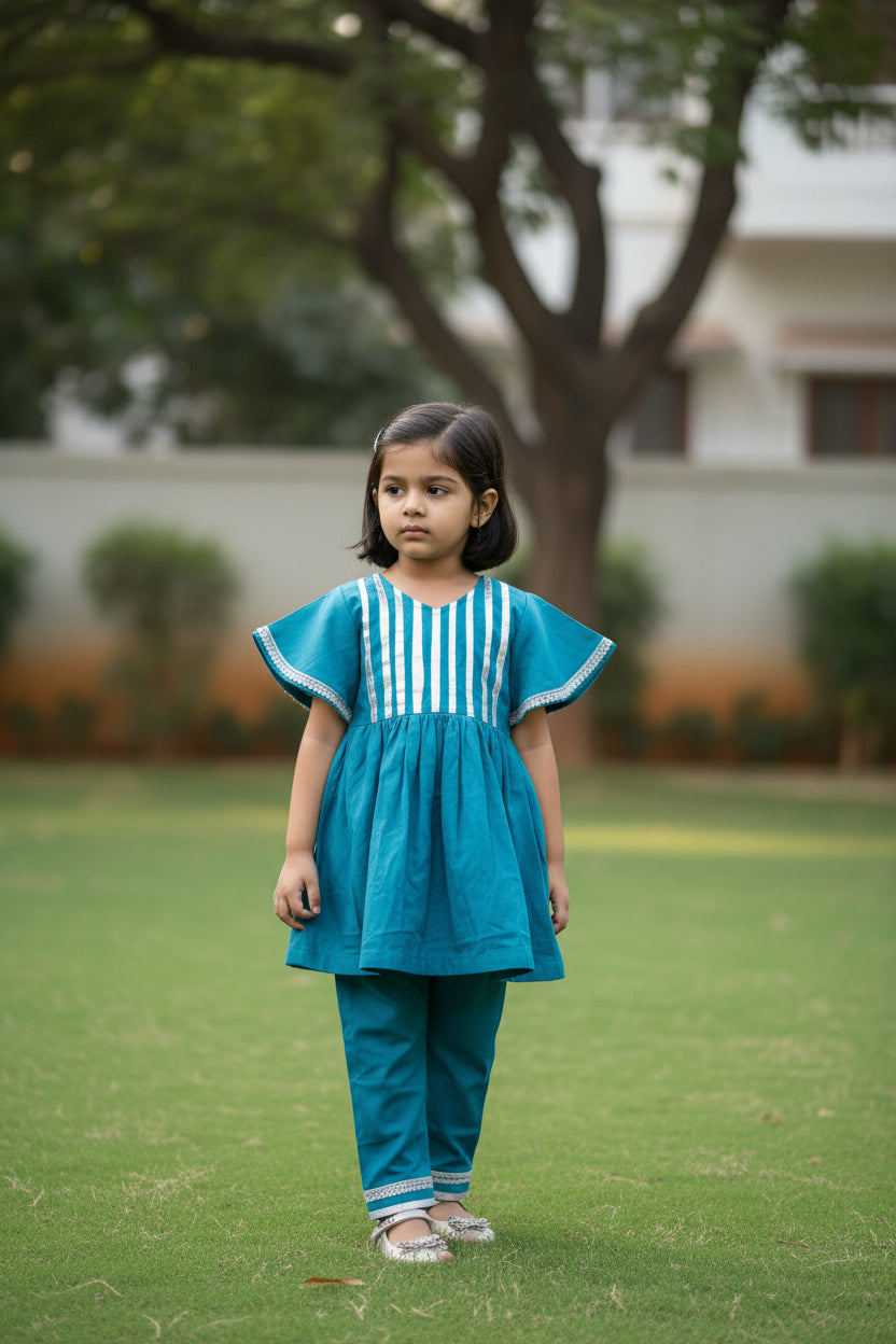 Blue children's outfit with white stripes on a gray background