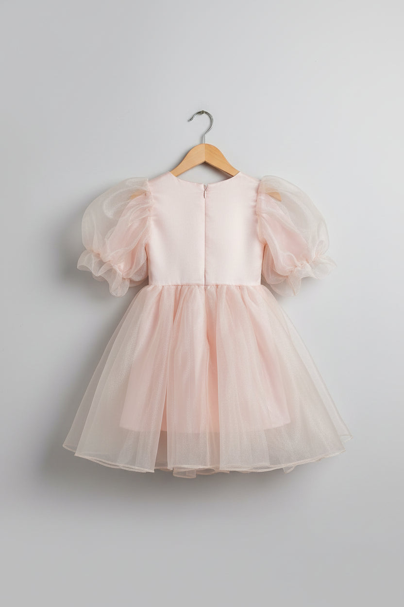 Pink baby outfit with a green and gold on hanger