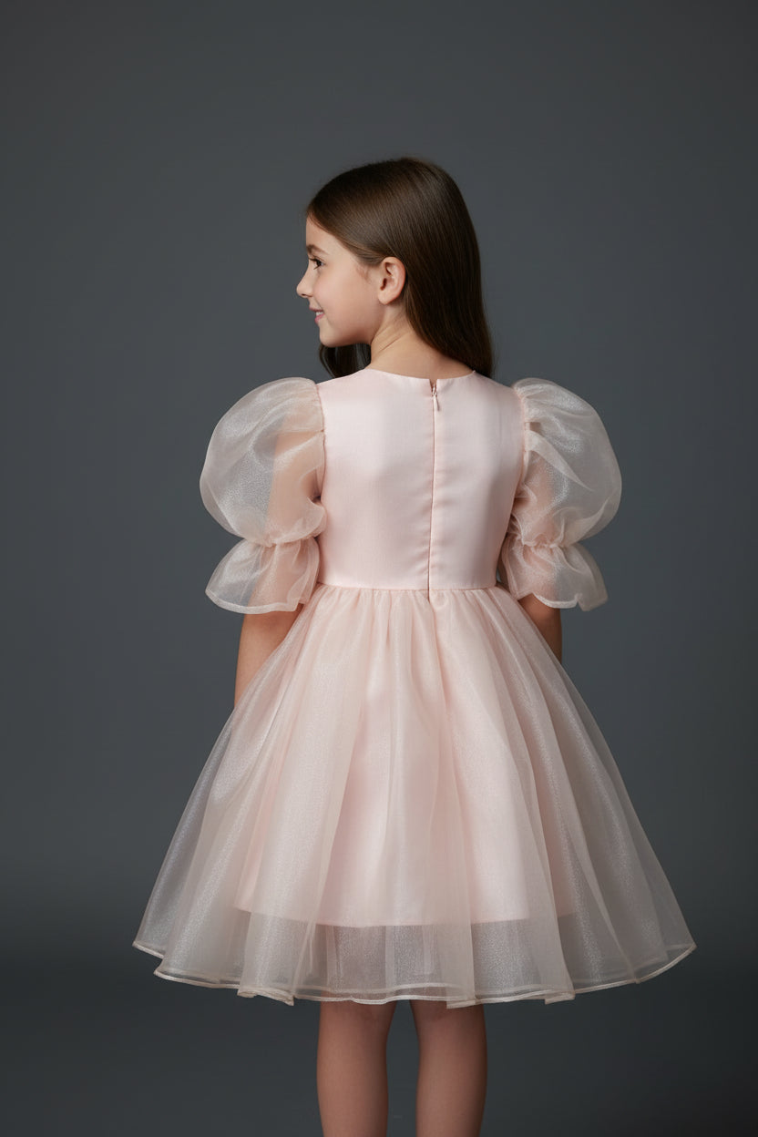 Pink baby outfit with a green and gold patterned background