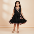 Girls black cotton viscose wrap dress with colourful printed trims and tassels