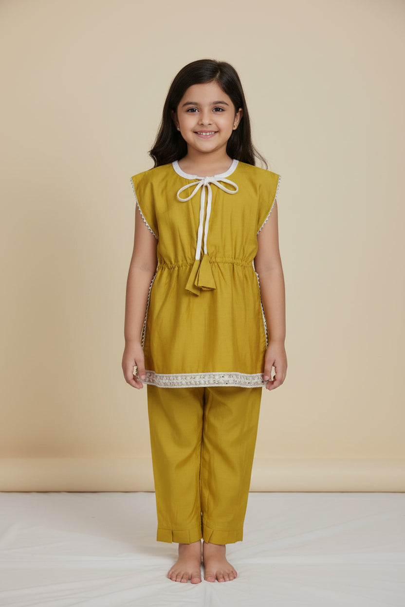 Girls mustard yellow cotton viscose kurti with lace and tassel tie-up
