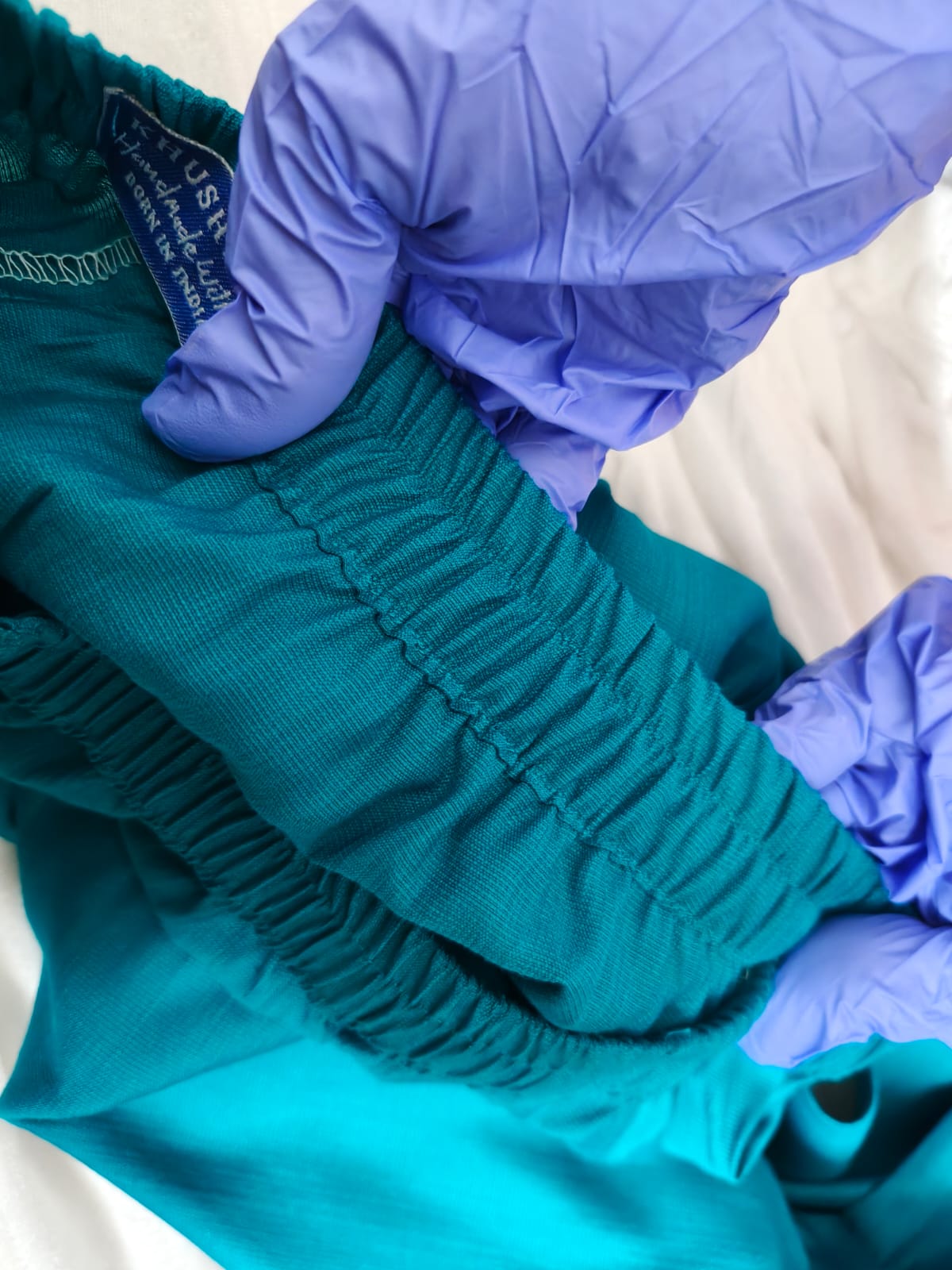 Close-up of a garment undergoing quality inspection